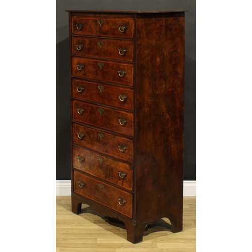 1565 - An unusual 18th century walnut and burr elm chest, of eight long drawers, brass swing handles, shape... 