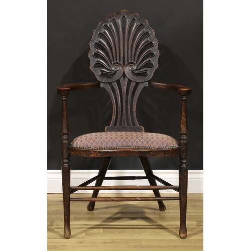 1555 - An Art Nouveau mahogany boudoir chair, shaped back pierced and carved as an anthemion, stuffed-over ... 