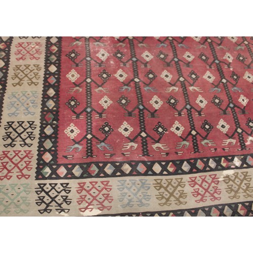 2112 - A Turkish Sarkoy Kilim rug or carpet, worked in the traditional manner, 339cm x 261cm