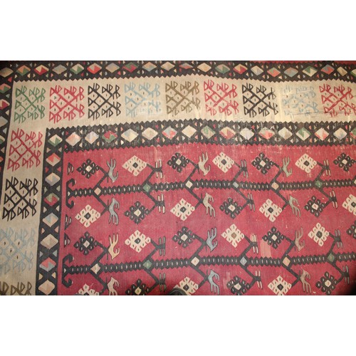 2112 - A Turkish Sarkoy Kilim rug or carpet, worked in the traditional manner, 339cm x 261cm