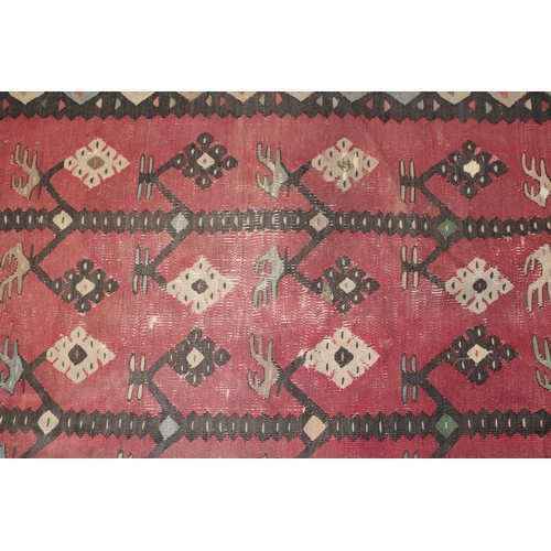 2112 - A Turkish Sarkoy Kilim rug or carpet, worked in the traditional manner, 339cm x 261cm