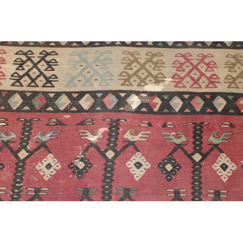 2112 - A Turkish Sarkoy Kilim rug or carpet, worked in the traditional manner, 339cm x 261cm