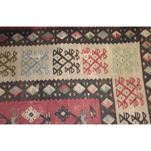 2112 - A Turkish Sarkoy Kilim rug or carpet, worked in the traditional manner, 339cm x 261cm