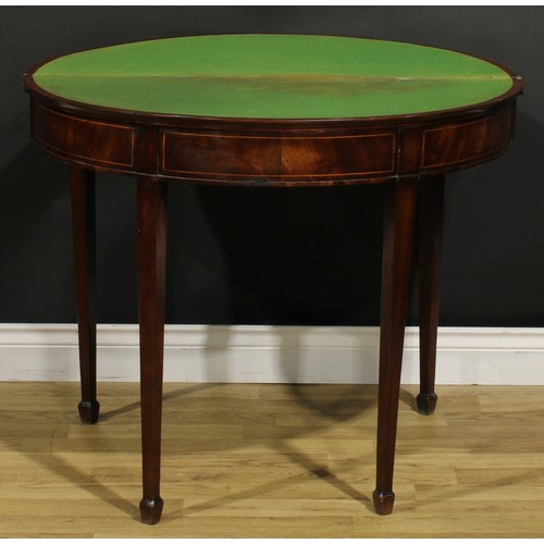 1308 - A George III mahogany demilune card table, hinged top with moulded edge enclosing a baize lined play... 