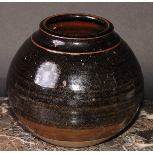 10 - Margaret Leach (b.1918) - a stoneware globular reeded vase, tenmoku glaze, 15cm high, impressed mark