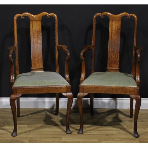 2104 - A pair of Arts & Crafts period vernacular oak George I design elbow chairs, each with a shaped crest... 