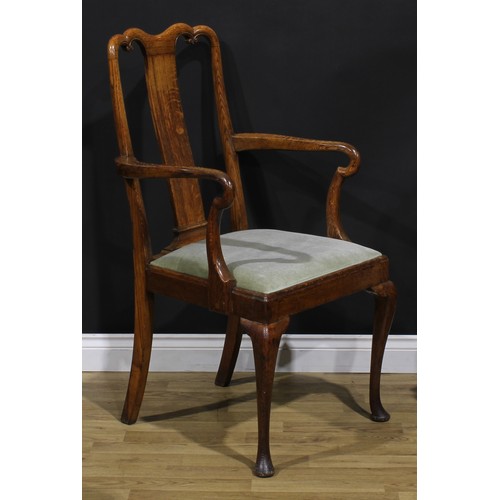 2104 - A pair of Arts & Crafts period vernacular oak George I design elbow chairs, each with a shaped crest... 