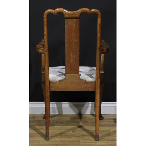 2104 - A pair of Arts & Crafts period vernacular oak George I design elbow chairs, each with a shaped crest... 