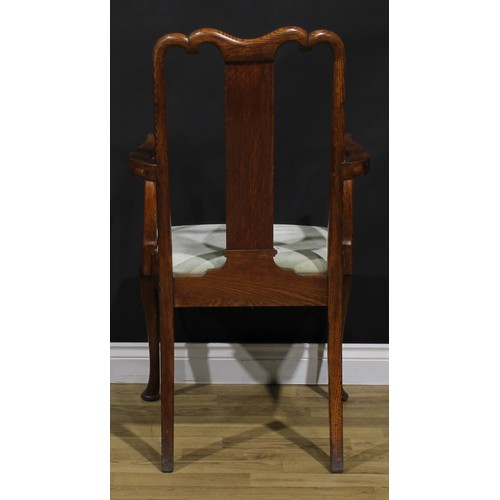 2104 - A pair of Arts & Crafts period vernacular oak George I design elbow chairs, each with a shaped crest... 