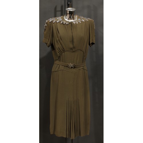 2544 - Vintage Fashion - A Norman Hartnell silk crepe dress, in khaki green/brown, the shaped collar accent... 