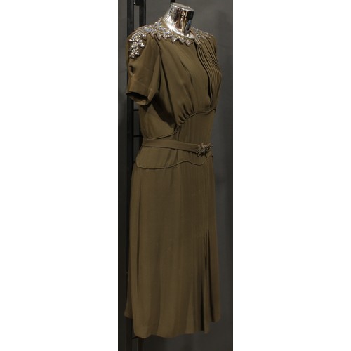 2544 - Vintage Fashion - A Norman Hartnell silk crepe dress, in khaki green/brown, the shaped collar accent... 