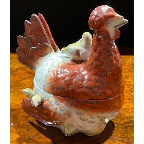 116 - A 19th century Staffordshire pottery dish and cover, modelled as a hen and chicks, the plumage in ru... 