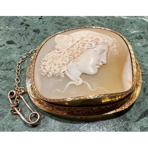 921 - A Victorian conch shell cameo brooch, well carved with a portrait Probably of Mercury or Hebe, with ... 