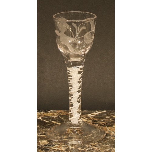 299 - A George III opaque twist drinking glass, the bowl etched with fanciful bird and foliage, double-hel... 