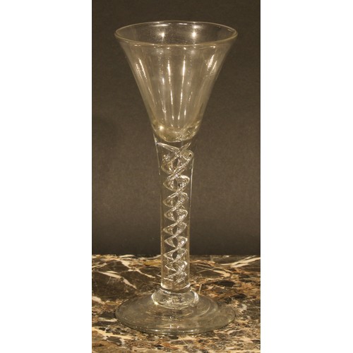 293 - A George III air twist drinking glass, trumpet shaped bowl, double helix twist stem, domed circular ... 