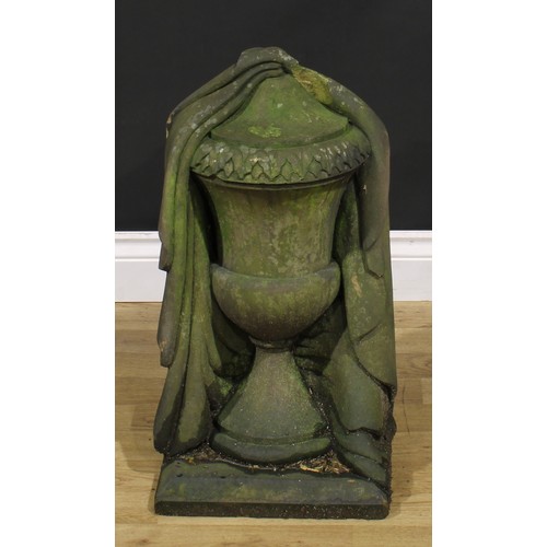 1515 - A carved stone draped urn, 58cm high, the base 30.5cm square