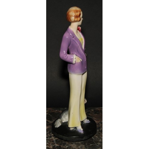 276 - An Art Deco Goebel figure, of a young lady and a dog, 24cm high, impressed monogram, model no. FF10,... 