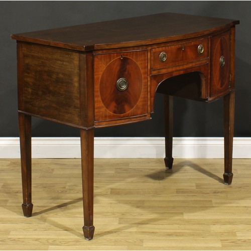 2127 - An Edwardian Regency Revival mahogany bow-centre sideboard or serving table, slightly oversailing to... 