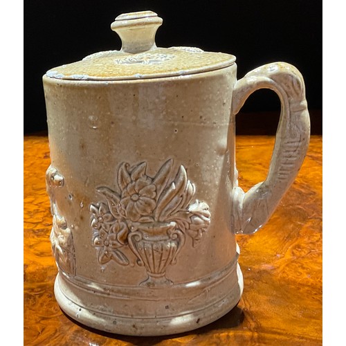 89 - A 19th century Brampton salt glazed stoneware puzzle jug, shaped cresting, the neck pierced with hea... 
