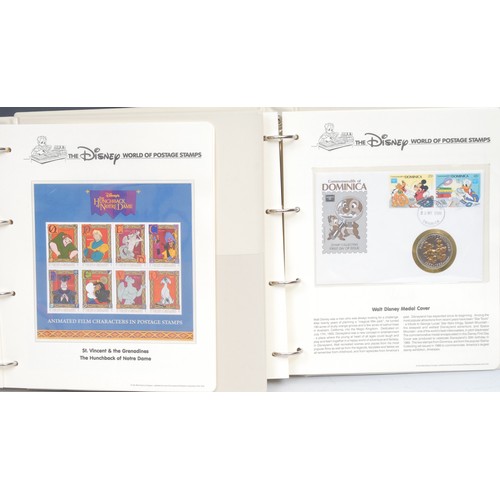 2678 - Stamps - two Disney stamp albums, including cased coin cover, etc