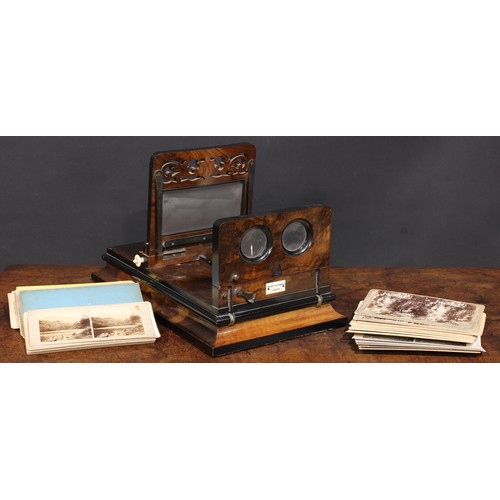 2198 - A Victorian walnut table top stereoscopic viewer, by Negretti & Zambra, London, pierced fretwork fri... 