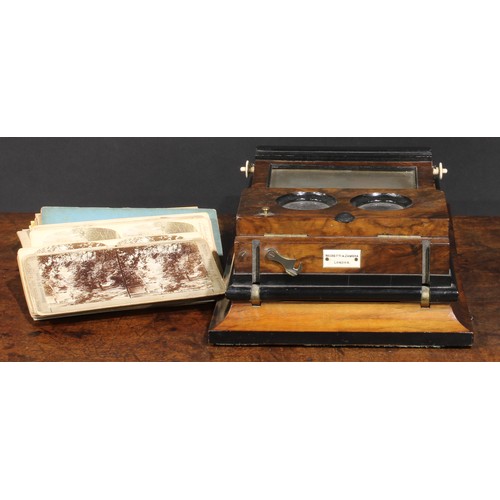 2198 - A Victorian walnut table top stereoscopic viewer, by Negretti & Zambra, London, pierced fretwork fri... 