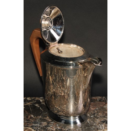 806 - An Elizabeth II silver coffee pot, in the Art Deco taste, angular wooden handle, oval pedestal base,... 