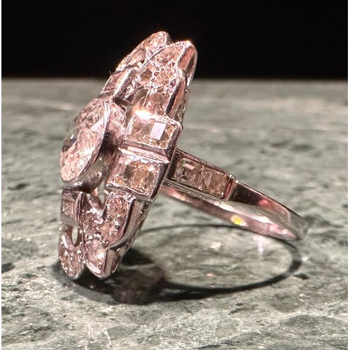 858 - An Art Deco style diamond cluster ring, the central round facet cut stone approximately 1.3ct within... 