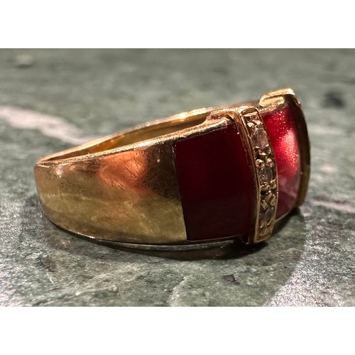 892 - A French diamond and ruby red chatoyant enamel dress ring, with three ruby red sections divided by r... 