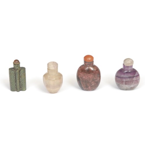 416 - A Chinese polished amethyst snuff bottle, domed stopper, 6.5cm high; an octagonal quartz snuff bottl... 