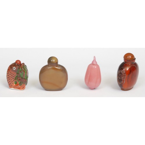 382 - A Chinese agate snuff bottle, carved with horses beneath a tree, 7cm high; a pink hardstone snuff, a... 