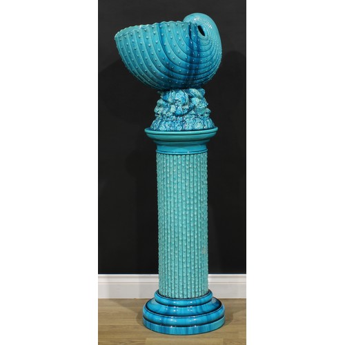 18 - A Burmantofts faience turquoise glaze jardiniere and pedestal, as a nautilus shell on a naturalistic... 