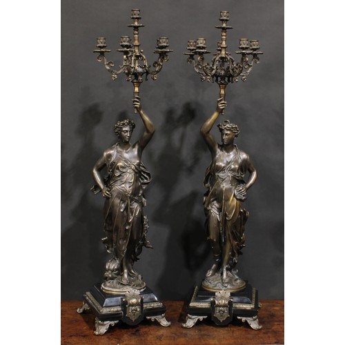 2169 - Jean-Louis Grégoire (French, 1840-1890), after, a pair of patinated bronze figural candelabra, signe... 