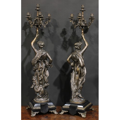 2169 - Jean-Louis Grégoire (French, 1840-1890), after, a pair of patinated bronze figural candelabra, signe... 