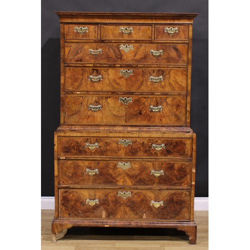 2069 - A George II walnut chest on chest, concave moulded cornice above three short and three long graduate... 