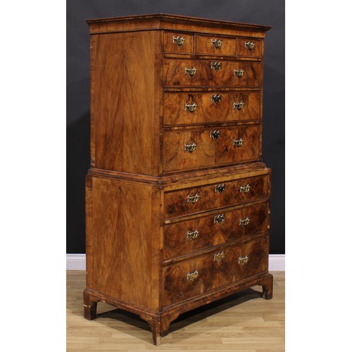 2069 - A George II walnut chest on chest, concave moulded cornice above three short and three long graduate... 