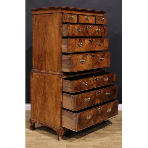 2069 - A George II walnut chest on chest, concave moulded cornice above three short and three long graduate... 