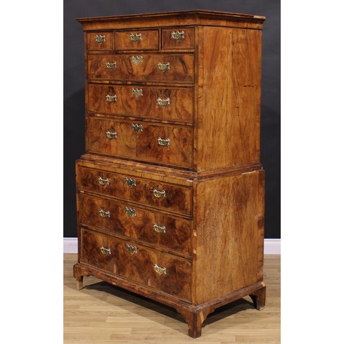 2069 - A George II walnut chest on chest, concave moulded cornice above three short and three long graduate... 