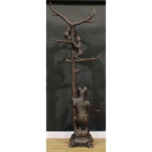 1657 - A Black Forest hall stand, carved in the traditional manner with a bear beside a tree, guarding her ... 