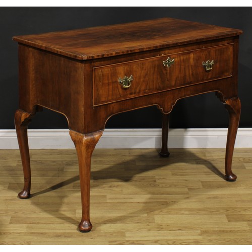 2070 - A George II walnut side table, crossbanded and featherbanded top with reentrant foreangles above a l... 