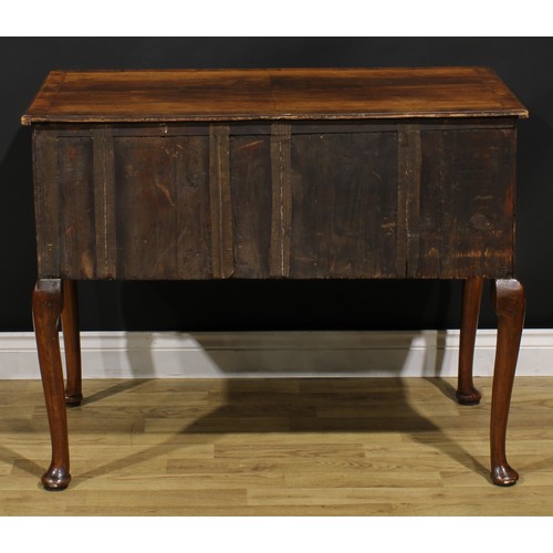 2070 - A George II walnut side table, crossbanded and featherbanded top with reentrant foreangles above a l... 