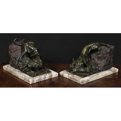 1505 - Continental School, 19th century, a pair of patinated bronze and stone sculptures, Combat, a lion in... 