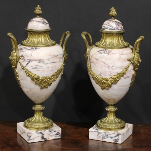 2174 - A pair of Louis XVI Revival gilt metal mounted marble pedestal ovoid urns, 46cm high, early 20th cen... 