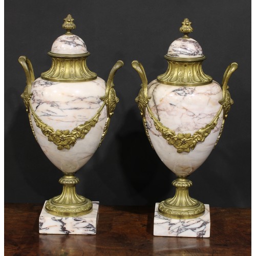 2174 - A pair of Louis XVI Revival gilt metal mounted marble pedestal ovoid urns, 46cm high, early 20th cen... 