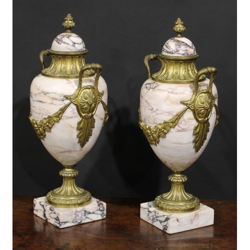 2174 - A pair of Louis XVI Revival gilt metal mounted marble pedestal ovoid urns, 46cm high, early 20th cen... 