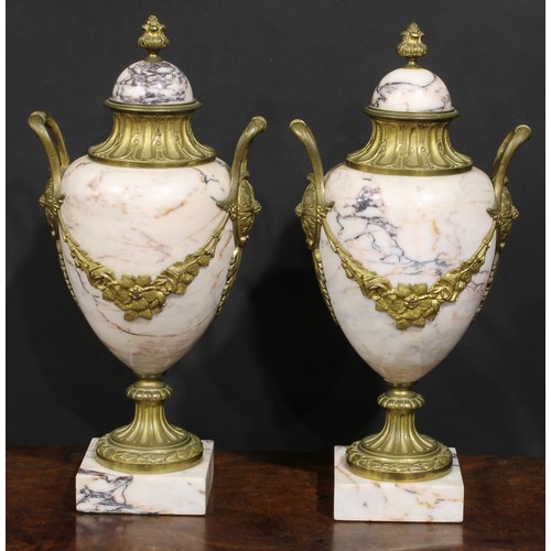 2174 - A pair of Louis XVI Revival gilt metal mounted marble pedestal ovoid urns, 46cm high, early 20th cen... 