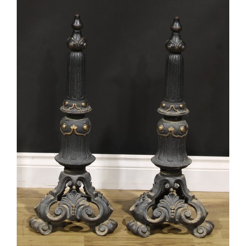 2105 - A pair of cast iron country house andirons, cast with foliate motifs, scroll feet, 67cm high