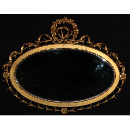 2110 - An Adam Revival giltwood and gesso oval looking glass, bevelled mirror plate, the ribbon-tied frame ... 