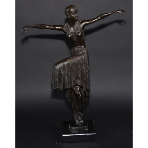 1640 - An Art Deco style dark patinated bronze, dancing girl in flapper dress and cap, arms outstretched, c... 