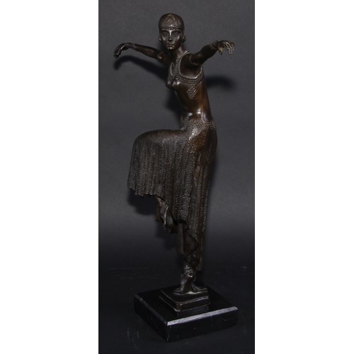 1640 - An Art Deco style dark patinated bronze, dancing girl in flapper dress and cap, arms outstretched, c... 